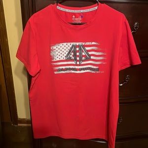 A red shirt made by alpha prime